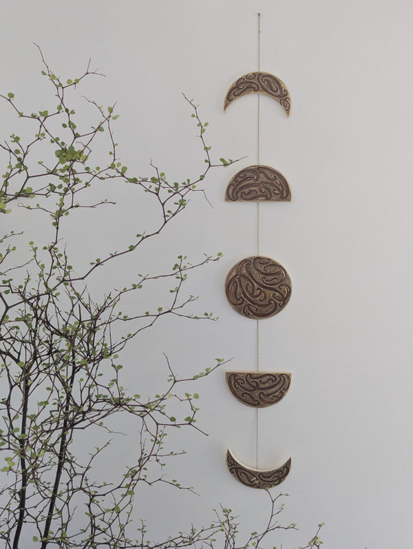 Ngā mata o te marama- Ceramic moon phases: Parauri